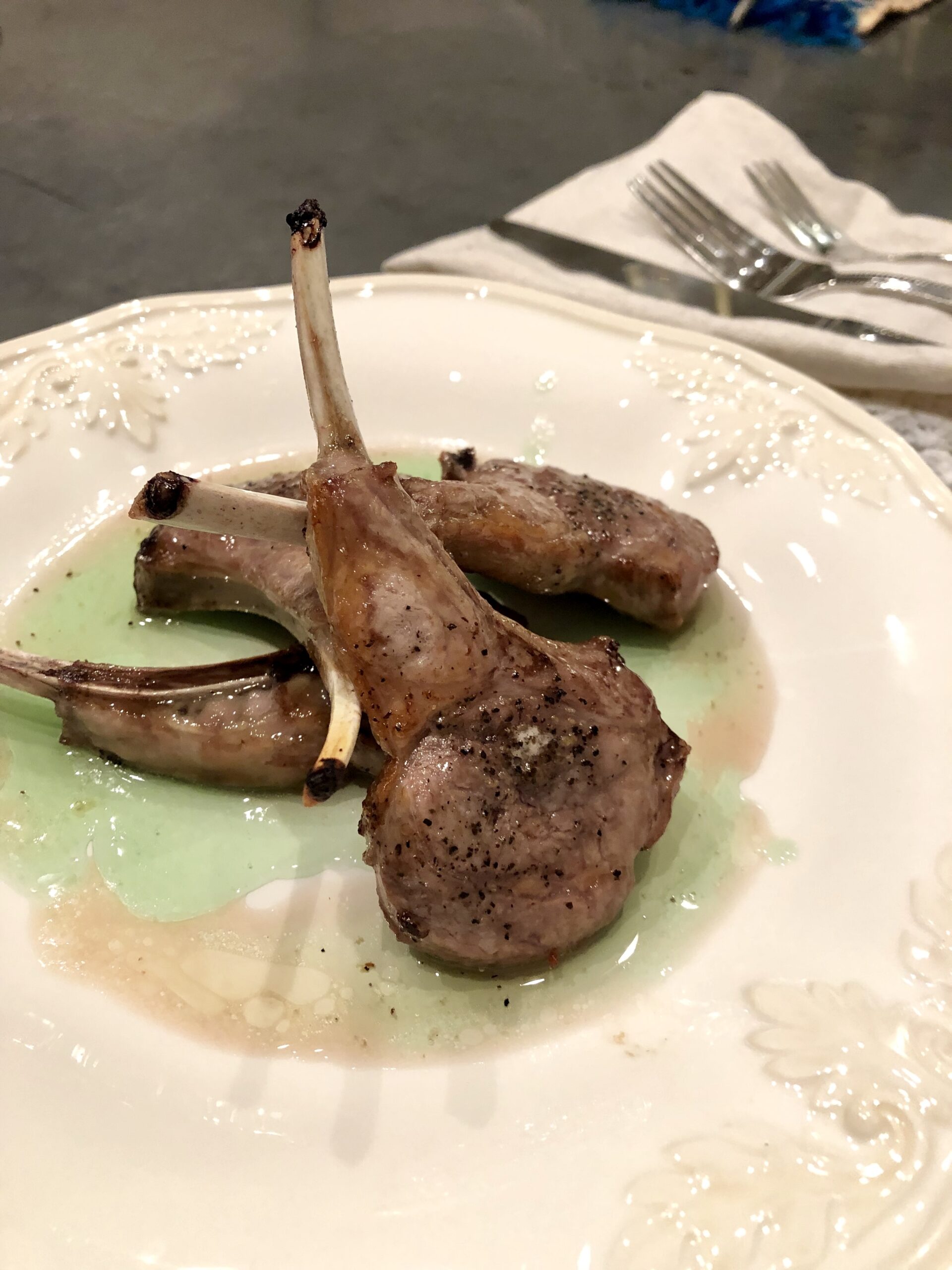 Lamb Chops served with herb roasted potatoes and garlic asparagus